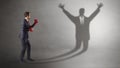 Businessman fighting with a disarmed businessman shadow Royalty Free Stock Photo