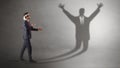 Businessman fighting with a disarmed businessman shadow Royalty Free Stock Photo