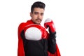 Businessman in boxing gloves and superhero red cloak raises hand to camera Royalty Free Stock Photo