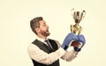 businessman in boxing gloves with trophy. successful ceo boxer. relentless struggle and success Royalty Free Stock Photo