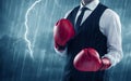 Businessman boxing in rain Royalty Free Stock Photo