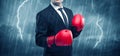 Businessman boxing in rain Royalty Free Stock Photo