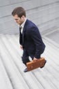 Businessman With Briefcase Ascending Steps Royalty Free Stock Photo