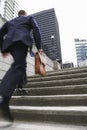 Businessman With Briefcase Ascending Steps