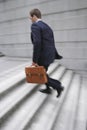 Businessman With Briefcase Ascending Steps Royalty Free Stock Photo