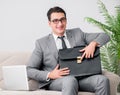 Businessman with briefcase in business concept