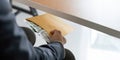 Businessman briefcase document envelope with dollar banknotes while money passes under a table. business accept illegal