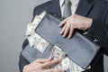 Businessman with a briefcase full of money in the hands of Royalty Free Stock Photo