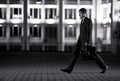 Businessman with briefcase at night city Royalty Free Stock Photo