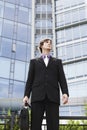 Businessman With Briefcase Outside Building Royalty Free Stock Photo