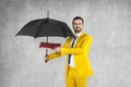 Businessman with briefcase protects data under the umbrella Royalty Free Stock Photo