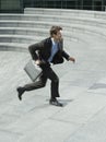 Businessman With Briefcase Running Upstairs Royalty Free Stock Photo