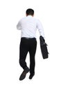 Businessman with briefcase running on white background, back view Royalty Free Stock Photo
