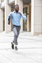 Businessman with briefcase running Royalty Free Stock Photo