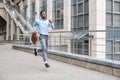 Businessman with briefcase running