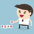 Businessman is building BRAND word, flat design Royalty Free Stock Photo