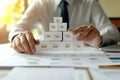 Businessman Building Data Pyramid Charts, Graphs, Strategy, Analysis