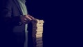 Businessman building a tower of stacked blocks Royalty Free Stock Photo