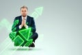 A businessman in a business suit looking for an opportunity against the background of green arrows pointing up. Development