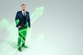 A businessman in a business suit looking for an opportunity against the background of green arrows pointing up. Development