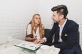 Businessman and business woman analyzing income charts and graph Royalty Free Stock Photo