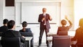 Businessman and business women raises his hand to ask a question to the meeting Royalty Free Stock Photo