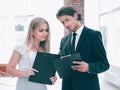 Businessman and businesswoman discussing documents before the me Royalty Free Stock Photo