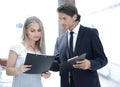 Businessman and businesswoman discussing documents before the meeting Royalty Free Stock Photo