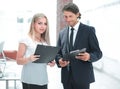 Businessman and businesswoman discussing documents before the meeting Royalty Free Stock Photo