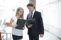 Businessman and businesswoman discussing documents before the meeting Royalty Free Stock Photo