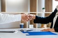 Businessman and businesswoman handshaking over the office desk after Greeting new colleague, business meetings concept Royalty Free Stock Photo