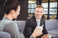 Businessman and businesswoman having tea during breaktime