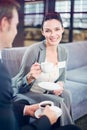 Businessman and businesswoman having tea during breaktime