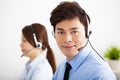 Businessman and businesswoman with headset working in office Royalty Free Stock Photo