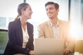 Businessman and businesswoman interacting using laptop Royalty Free Stock Photo