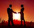 Businessman and Businesswoman meeting on sunset background