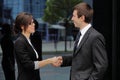 Businessman and businesswoman shaking hands Royalty Free Stock Photo