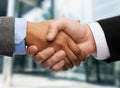 Businessman and businesswoman shaking hands