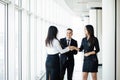 Businessman And Businesswoman Shaking Hands In Office hall at informal meeting Royalty Free Stock Photo