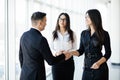 Businessman And Businesswoman Shaking Hands In Office hall at informal meeting Royalty Free Stock Photo