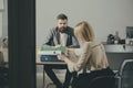 Businessman and businesswoman sit at office desk. Bearded man and woman have business meeting. Concentration at work Royalty Free Stock Photo