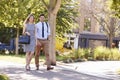 Businessman And Businesswoman Walk to Work Through City Park Royalty Free Stock Photo