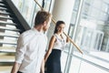 Businessman and businesswoman walking and taking stairs Royalty Free Stock Photo