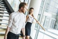 Businessman and businesswoman walking and taking stairs Royalty Free Stock Photo