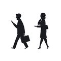 Businessman and businesswoman walking to office working talking and texting on smartphones on the way