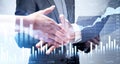 Businessman and businesswoman wearing formal suit shake hands