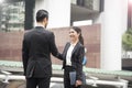 Businessman and businesswomen making handshake agreement.
