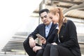 Businessman and businesswomen reading message in smart phone