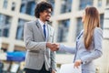 Businessman and businesswomen shaking hands outdoor Royalty Free Stock Photo