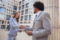 Businessman and businesswomen shaking hands outdoor Royalty Free Stock Photo